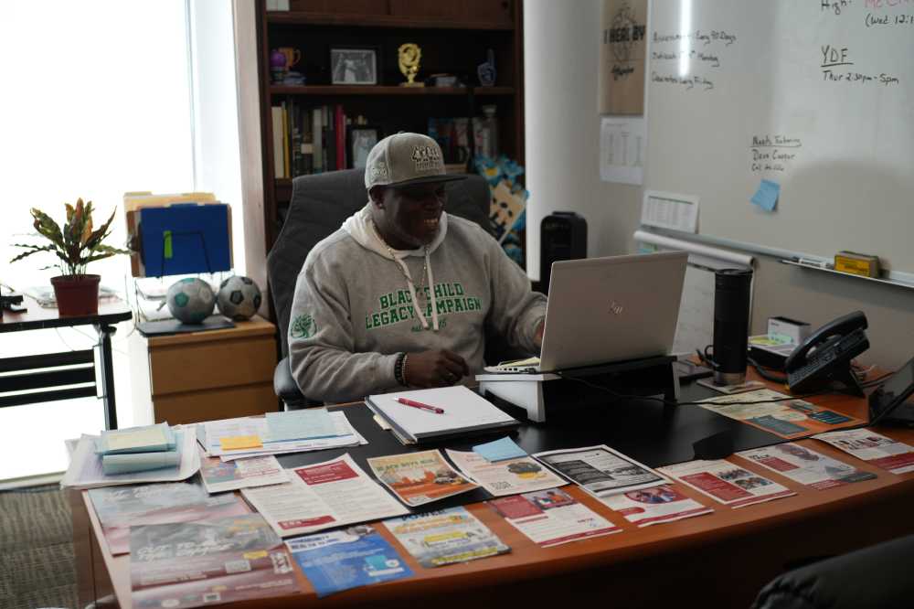 Man at Greater Sacramento Urban League working at his desk